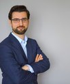 Man with glases in blue suit