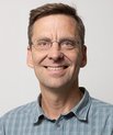 man in shirt and glases