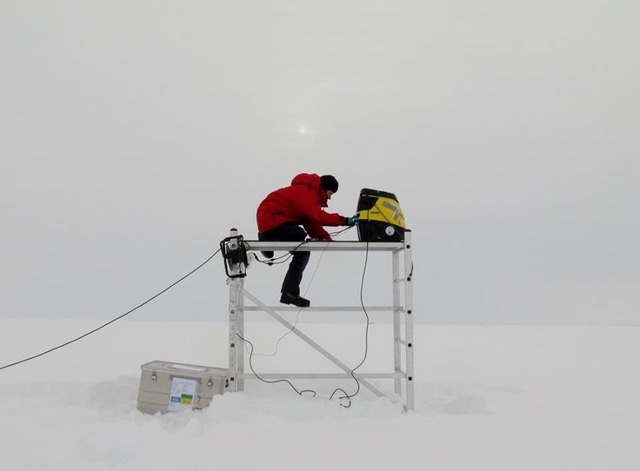 One of the trusty tools for doing air samples is a rebuilt vacuum cleaner; here mounted on the inland ice of Greenland. Tina Šantl-Temkiv is checking the equipment. Photo: David Babb.